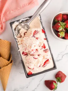 Strawberry ice cream in a loaf pan.
