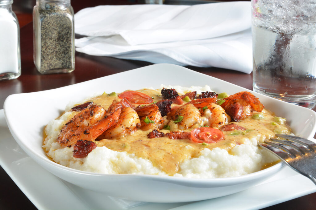 Sauteed shrimp and vegetable medly in a creole butter sauce on grits