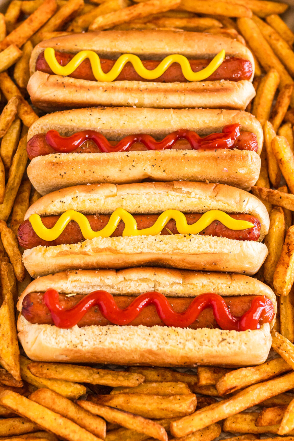 Hot dogs on a cooking sheet